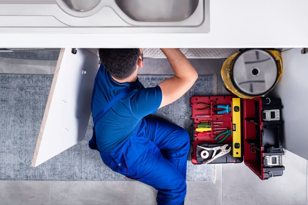 handyman Plumber repair the kitchen water pipe or sink